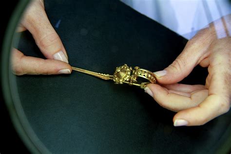 Conservation Of Iron Age Gold Brooch Photograph by Marco Ansaloni / Science Photo Library - Fine ...