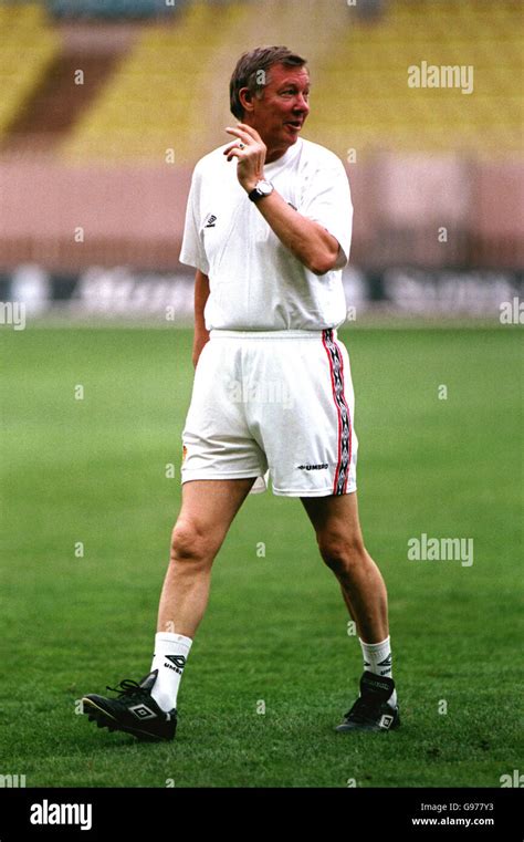 Manchester United manager Sir Alex Ferguson trains his players inside the Stade Louis II Stadium ...