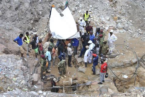 A survivor is pulled out of a Zambian mine nearly a week after being trapped. Dozens remain ...