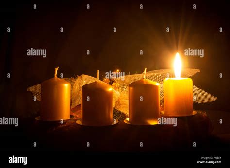 one burning candle in advent wreath Stock Photo - Alamy