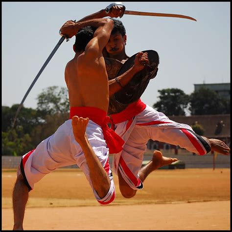 two men are fighting with each other outside