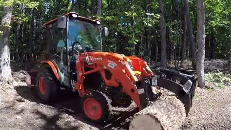 #322 Kubota LX2610 Compact Tractor. Cab tractor deep in the forest ...