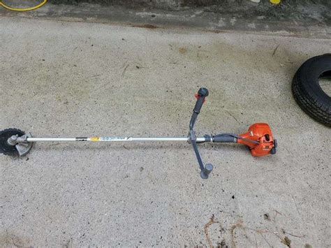 Gas powered brush cutter - McLaughlin Auctioneers, LLC- mc-bid.com