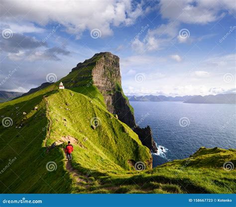 Kallur Lighthouse On Green Hills Of Kalsoy Island Stock Photography | CartoonDealer.com #182085914