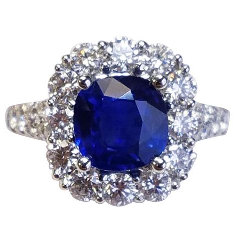 18 Karat White Gold Cushion Cut Sapphire and Diamond Ring For Sale at 1stdibs