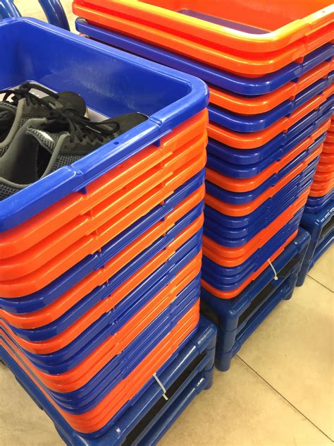 The bins at Jacksonville airport security are the Florida gators colors. : r/mildlyinteresting