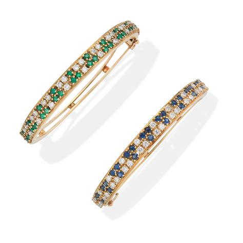 Bonhams : EMERALD AND DIAMOND BANGLE, AND SAPPHIRE AND DIAMOND BANGLE (2)