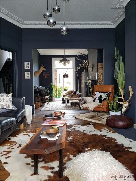 Boho Living Room Discover Cowhide Rug Dark Walls Love this dark decor broken up by the warmth of ...