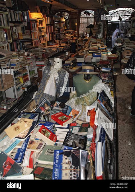 Books stacked in a gondola in The most beautiful bookstore library in ...