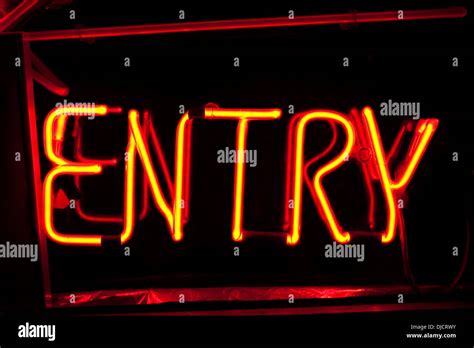 Neon sign entry Stock Photo - Alamy