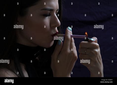 Portrait of the beautiful elegant girl smoking cigarette isolated on ...