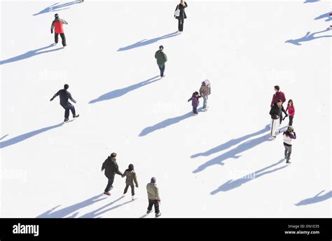 Aerial view of people skating in community rink during winter holiday season Stock Photo - Alamy