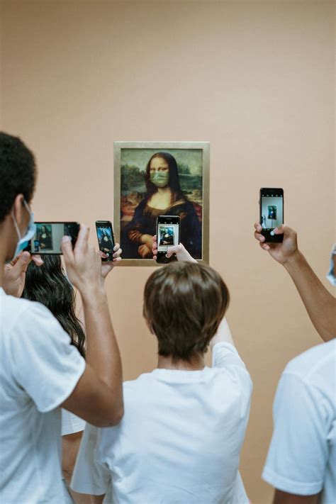 People Taking Picture Of Mona LIsa Painting With Face Mask · Free Stock Photo