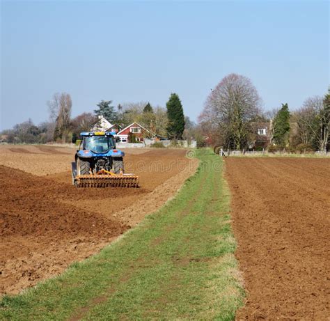 Tractor Ploughing a field stock image. Image of vehicles - 18724081