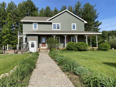 Charming farmhouse on 140 acres with lush pastures and multiple ...