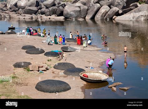 People bathing in the river. Hampi. Karnataka. India Stock Photo - Alamy