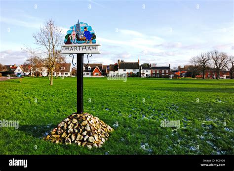 A view of the village sign and green at Martham, Norfolk, England ...