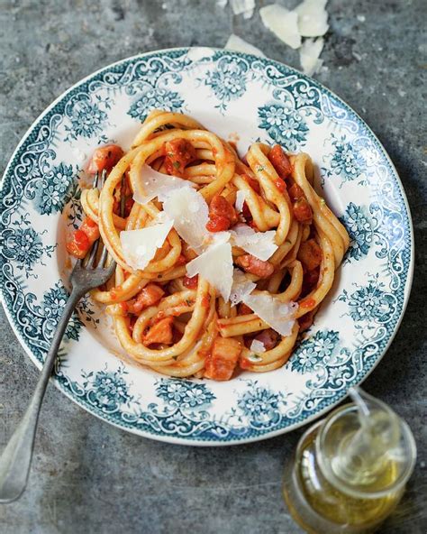 Perciatelli In Tomato Sauce, Diced Bacon And Parmesan Flakes Photograph ...