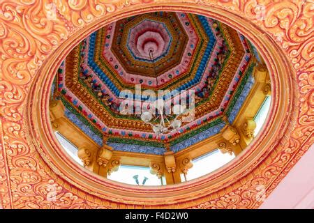 South America, Trinidad, Carapichaima. Hindu deities surrounding intricately carved door at ...