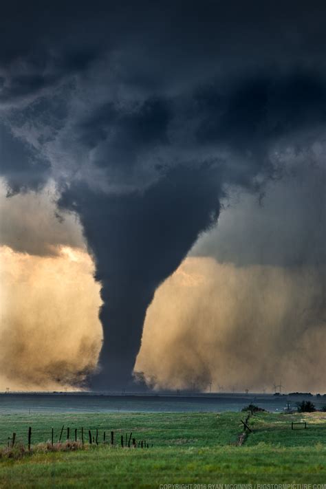 Atmospheric Phenomena — Tornado! A tornado churns near wind generators...