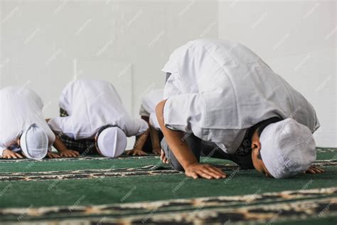 Premium Photo | A group of Muslims are praying in congregation with prostrating movements in the ...