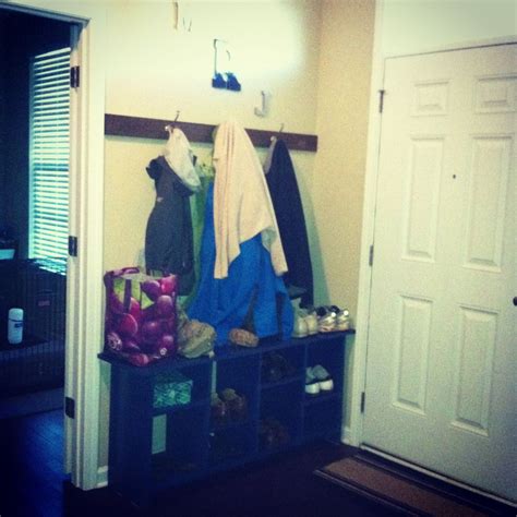 Organized our entryway and pile of shoes by building this bench out of MDF. A coat of primer and ...