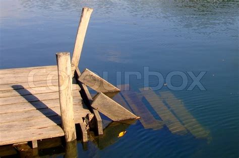 Old wooden boat dock on a beautiful ... | Stock image | Colourbox