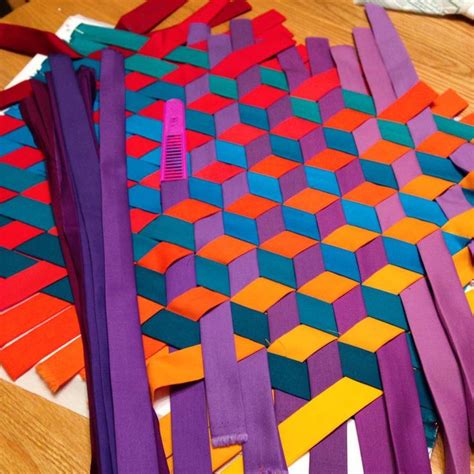 several pieces of colorful fabric laid out on a table