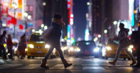 People Walking On Street At Night
