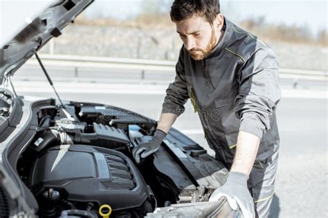 Auto Mechanic Repairing Car Outdoors Stock Photo - Image of hood ...