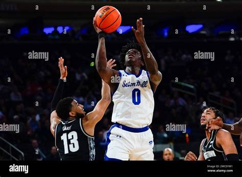 Seton Hall's Kadary Richmond (0) drives past Georgetown's Donald Carey ...