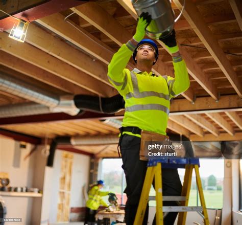 Air Conditioning Duct Install High-Res Stock Photo - Getty Images