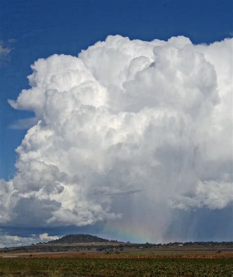 Cloud on rainbow | Storm cloud with a rainbow underneath. On… | Flickr