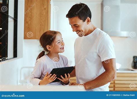 Laughing Dad and Girl Using a Tablet Stock Image - Image of ...