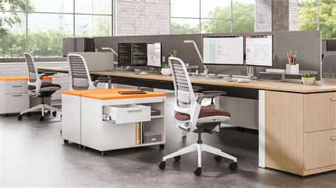 an office with multiple desks and chairs in it