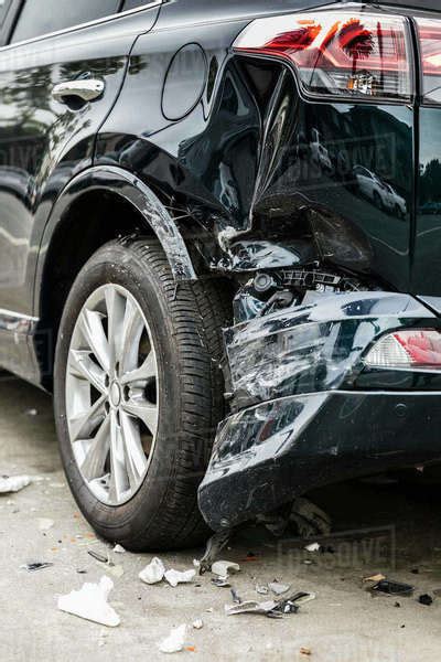 Damaged bumper from car accident - Stock Photo - Dissolve