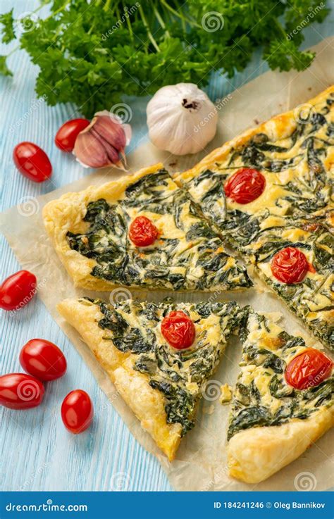 Homemade Spinach Puff Pastry Tart with Cheese and Tomatoes Stock Photo ...