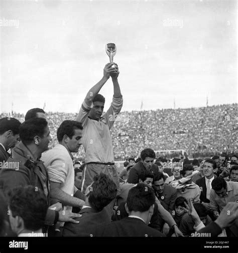 17 JUNE 1962 BRAZIL'S CAPTAIN, MAURO RAMOS, HOLDS ALOFT THE JULES RIMET TROPHY AFTER HIS TEAM ...