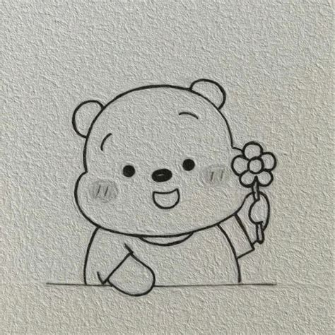 a drawing of a teddy bear holding a flower