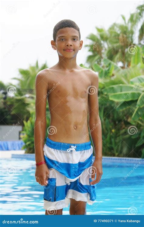 Boy at swimming pool. stock image. Image of camera, serious - 77490371