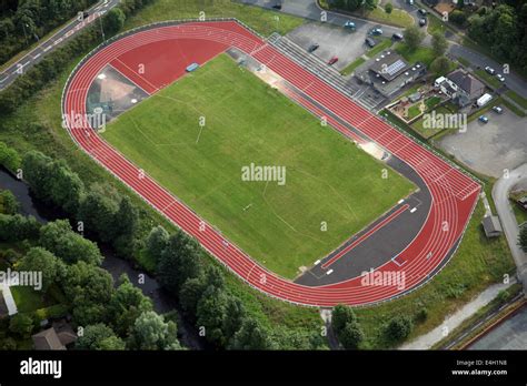 Aerial view of a red athletics running track and field. This one at Nelson, Lancashire Stock ...