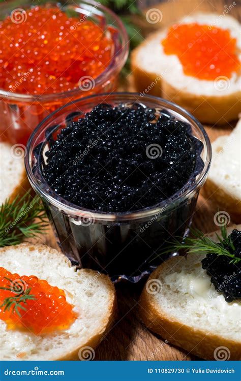 Traditional Red and Black Caviar and Sandwiches on Wooden Board Stock ...