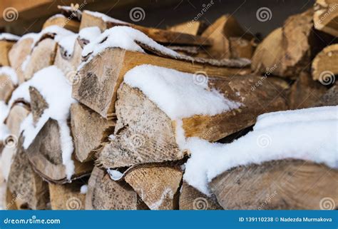 The Wood into the Fireplace with Snow Stock Photo - Image of pile, deforestation: 139110238