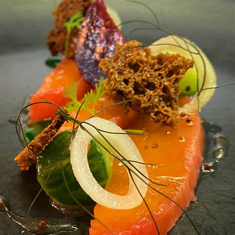 Festive starter Beetroot cured salmon, pickled shallots, compressed cucumber, walnut, treacle