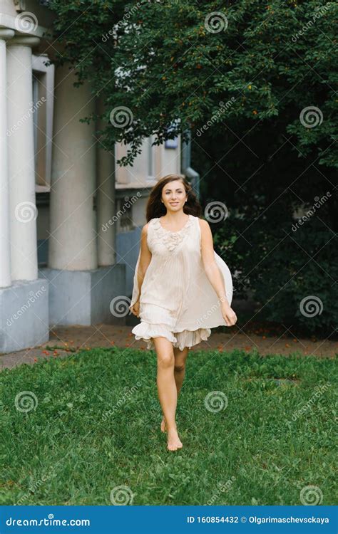 A Barefoot Girl in a Flying Dress Runs Across the Grass Stock Photo - Image of dance, beautiful ...