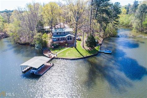 This property on Loh Rd in Monticello, GA wows lake residents from waterfront and interior. The ...