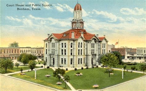 an old postcard shows the courthouse and public square