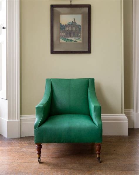 An antique HOWE London Howard chair covered in our Natural Maroc Goatskin in 'Malachite ...