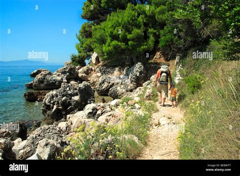 Tourists walking to Zivogosce Mala Duba villlage, Croatia Stock Photo: 26077303 - Alamy