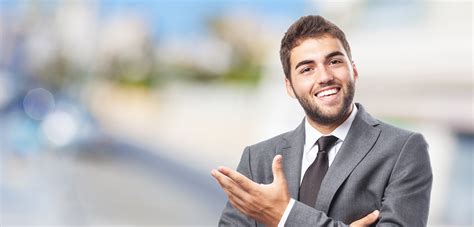 handsome young successful man doing a welcome gesture - Chartered Global Investment Analyst